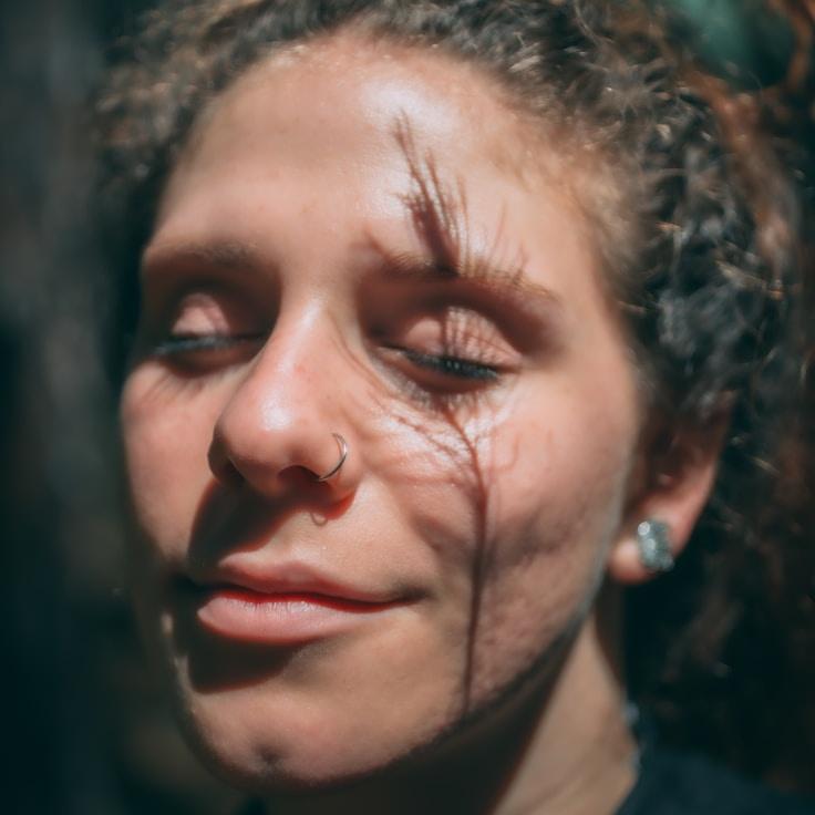 Avery Singh, Lead Design Curator at CalmRiverGroup, reviewing corporate floral arrangements